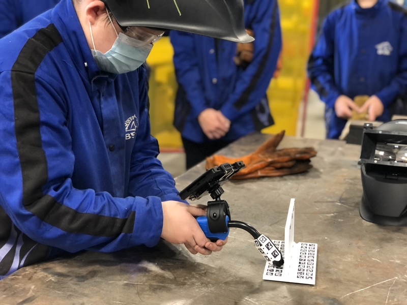 Student using the mobile arc welder